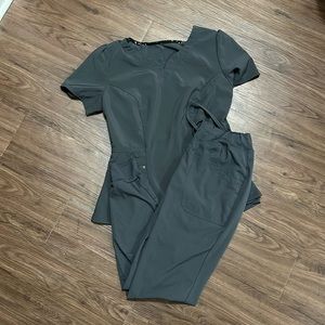 Gray Healing Hands scrubs.